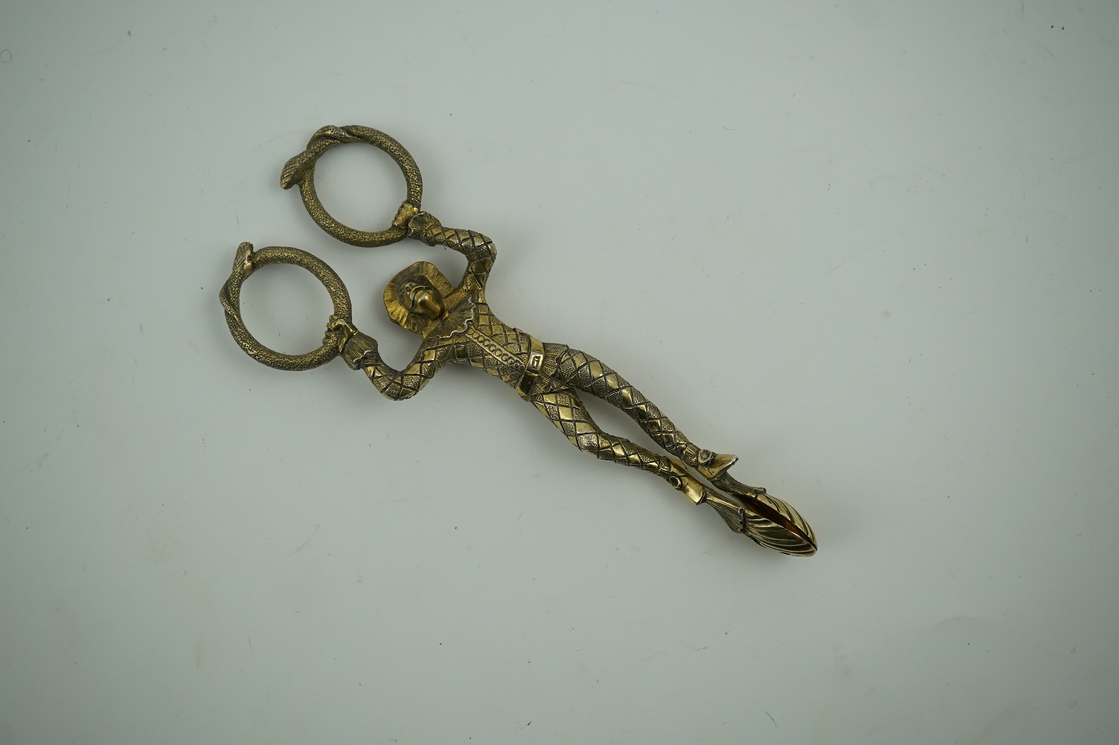 A pair Victorian of silver gilt harlequin sugar tongs, by Lias & Lias, London, 1867, 12.1cm. Condition - fair to good